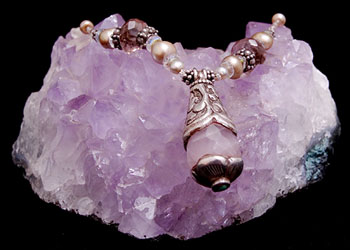 purple pendant on crystal